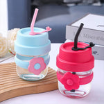 Load image into Gallery viewer, Flower‑Accent Silicone Grip Glass Bottle