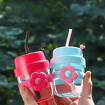 Load image into Gallery viewer, Flower‑Accent Silicone Grip Glass Bottle